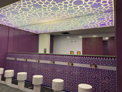 Bespoke decorative glass ceiling with geometric pattern and purple mosaic tile wall in luxury interior