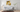 Contemporary living room with a yellow and white floral glass wall art 