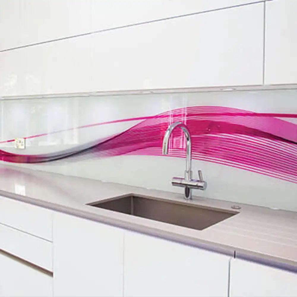 Bespoke pink wave-patterned glass splashback in modern kitchen with stainless steel sink