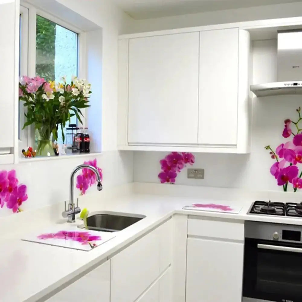 Modern white kitchen with floral glass splashback, sleek cabinets, and orchid decor for luxury interiors
