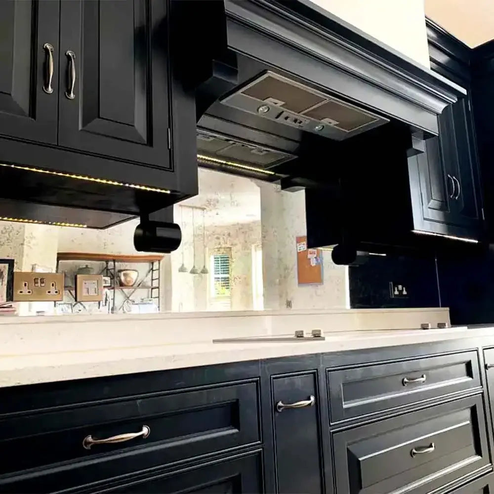 Made-to-measure mirror glass splashback in a luxury contemporary kitchen