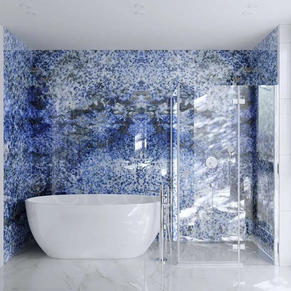 Luxury bathroom with blue speckled decorative glass wall and frameless shower enclosure
