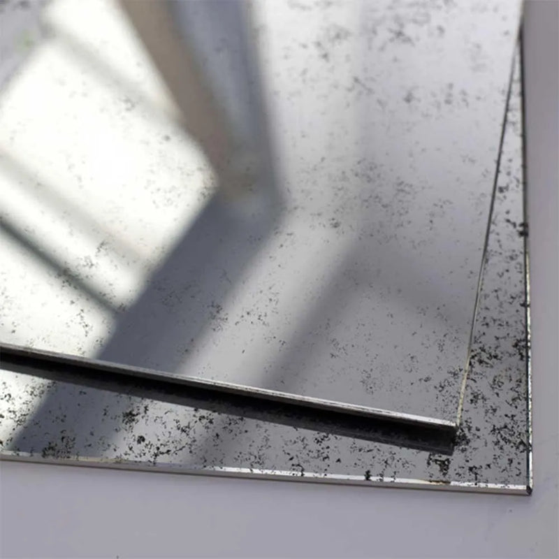 Antique-style distressed mirror with speckled finish and beveled edge for luxury interiors