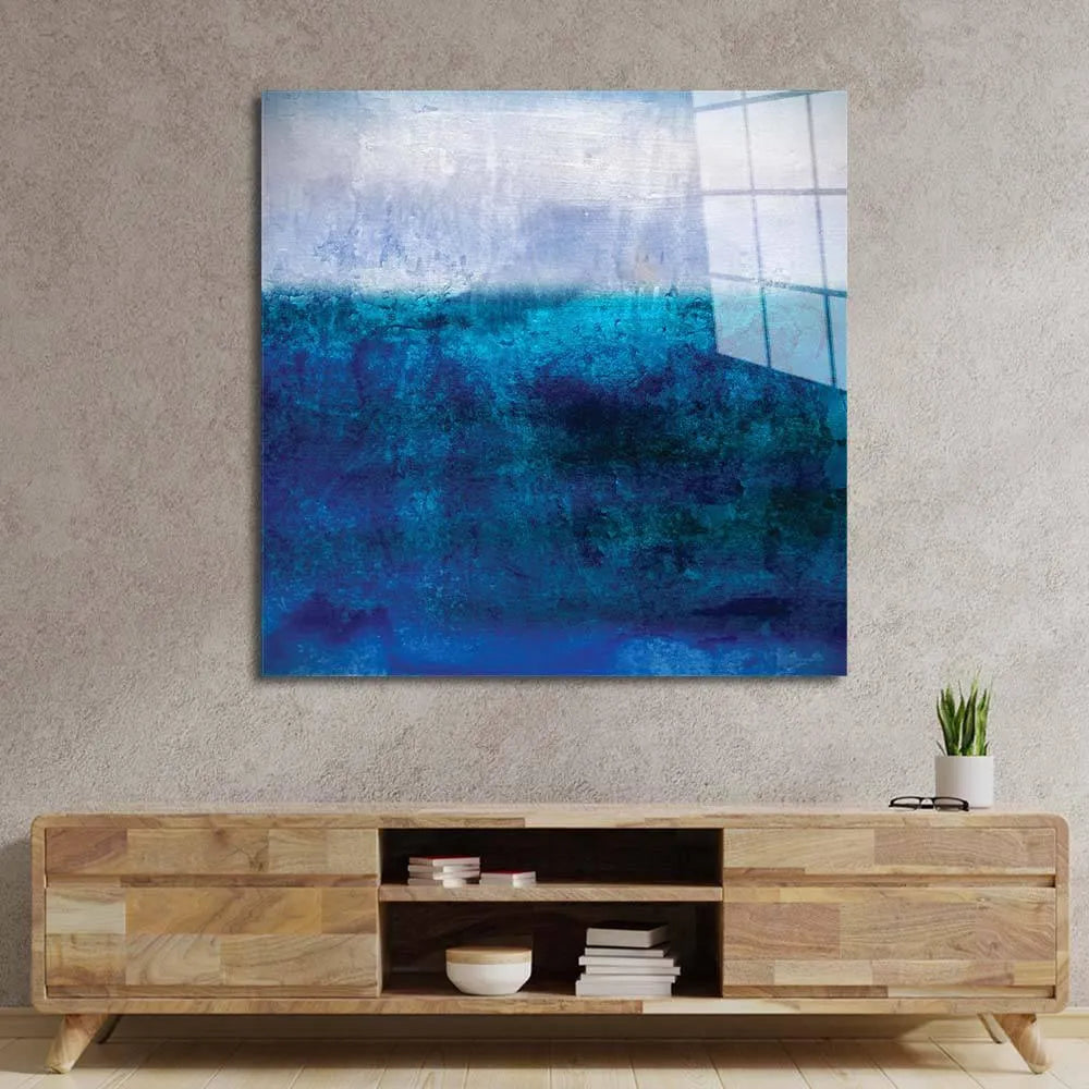 Bespoke blue abstract glass art panel mounted above modern wooden console in luxury interior