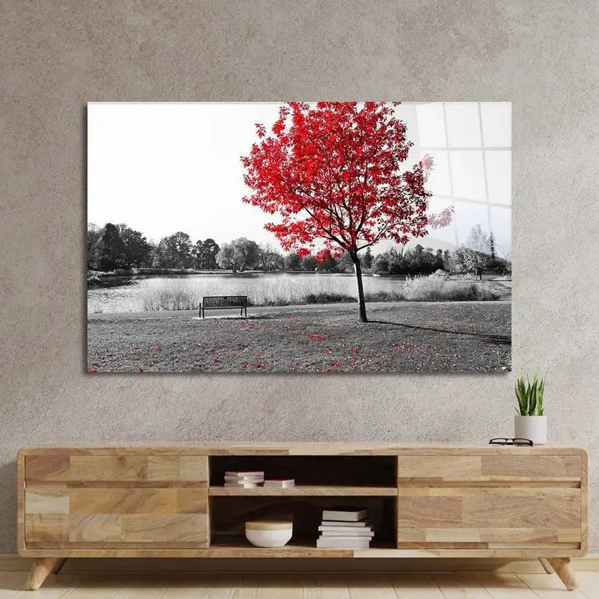 Bespoke decorative glass wall art featuring a vibrant red tree in monochrome landscape, perfect for luxury interiors.