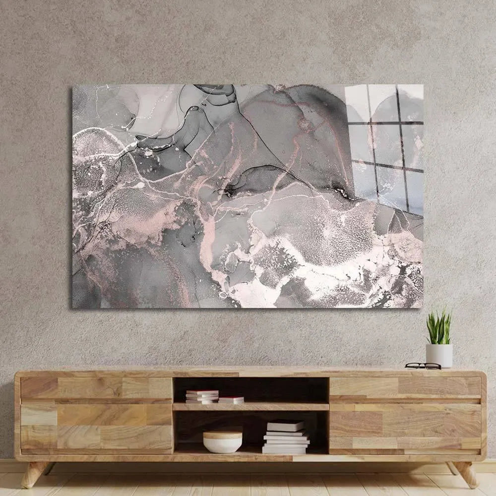 Abstract gray and pink glass art mounted above wooden console in modern living room