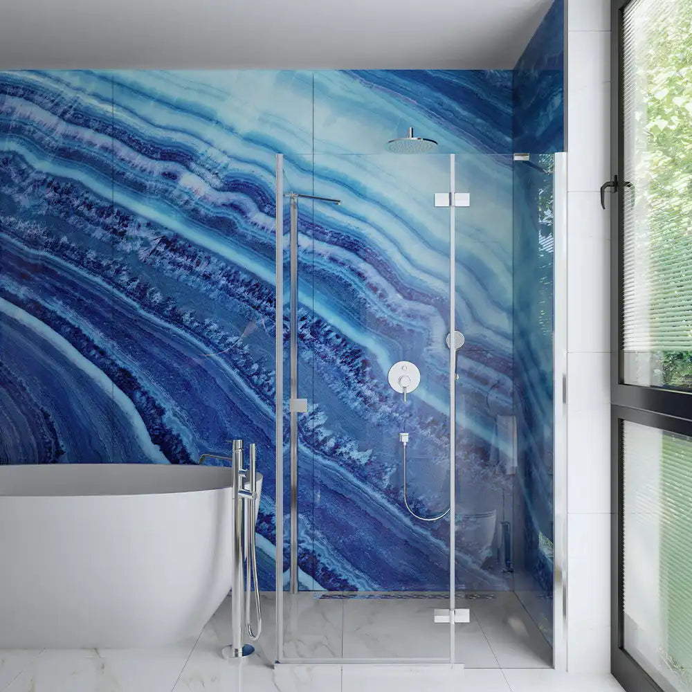 modern glass shower enclosure with onyx background