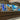 Bespoke LED backlit glass kitchen splashback with vibrant blue and gold abstract design