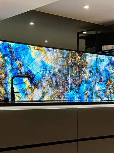 Large screen displaying a colorful abstract design in a modern interior setting.
