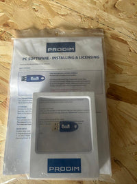 PRODIM USB license dongle for PC software installation and licensing, packaged with instructions