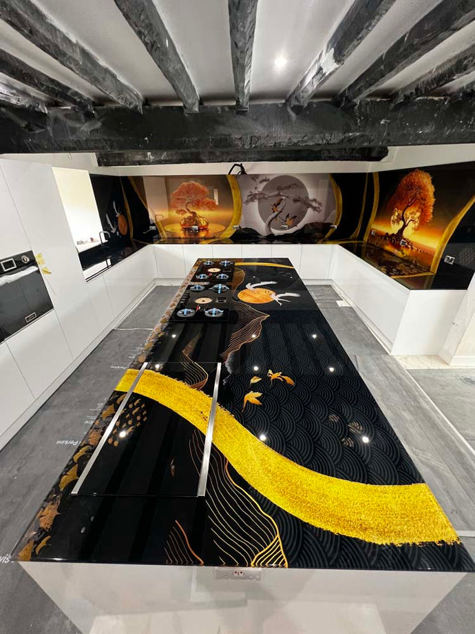 Luxury kitchen with bespoke black and gold decorative glass countertop and artistic glass backsplash