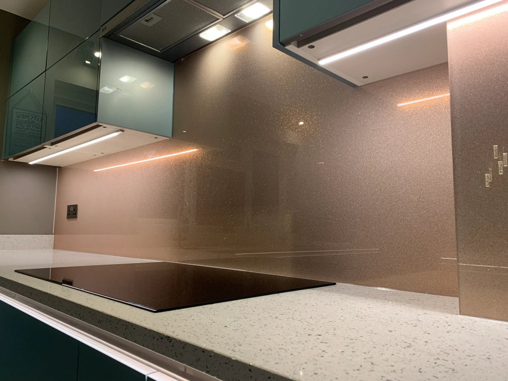 Rose gold fine glitter kitchen glass splashback made and installed by CreoGlass in London UK