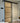 Frosted glass sliding door with black metal frame for modern interior design