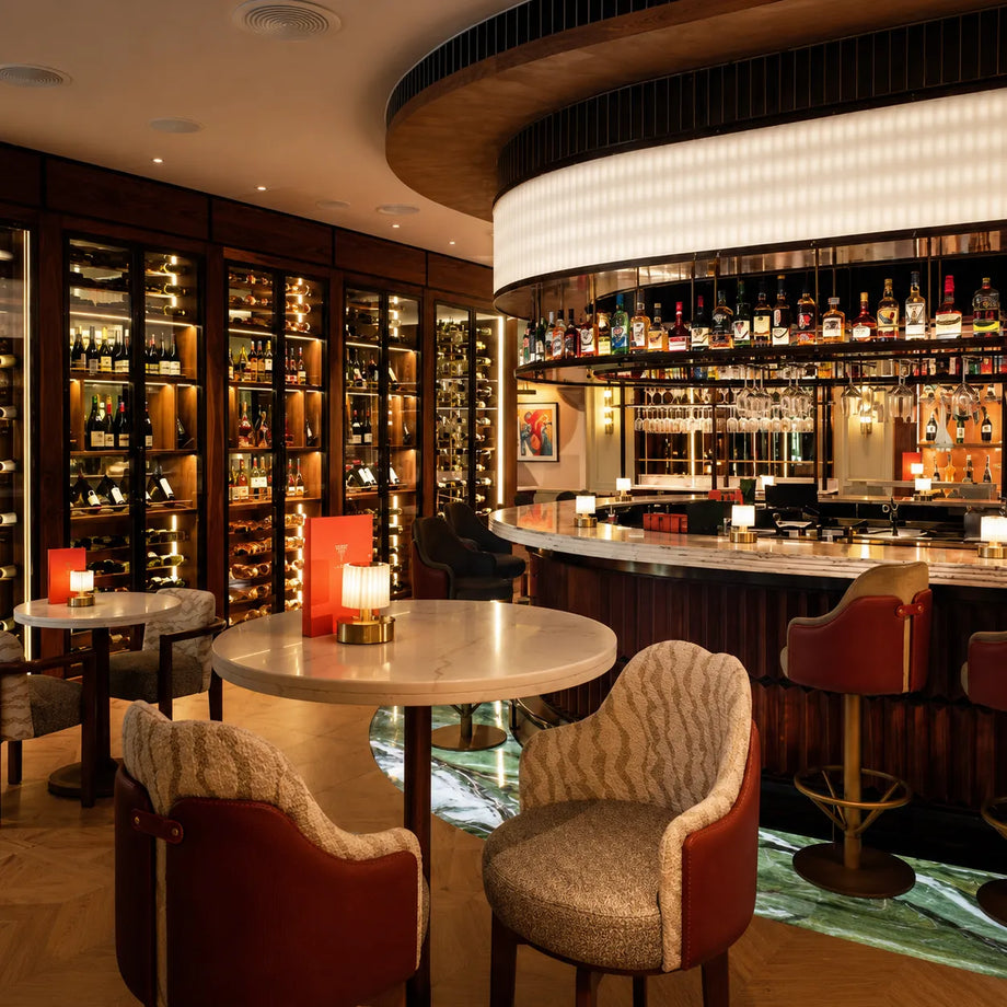 Illuminated glass floor and hospitality bar at Fairmont Windsor Park