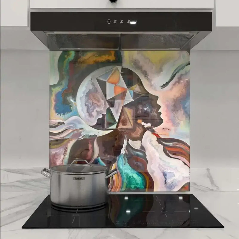 Bespoke abstract art glass splashback in modern kitchen with induction hob and extractor hood