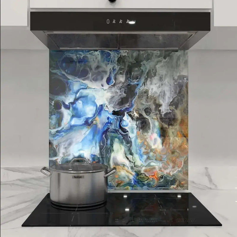 Abstract blue and grey marbled glass splashback in modern kitchen with induction hob