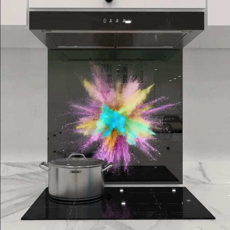 Vibrant powder explosion on custom glass splashback in modern kitchen, showcasing decorative glass design
