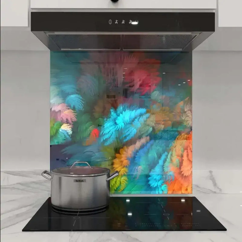 Colorful abstract glass kitchen splashback with vibrant floral design behind induction hob