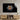 Tiger portrait on decorative glass wall art above wooden media console in modern living room
