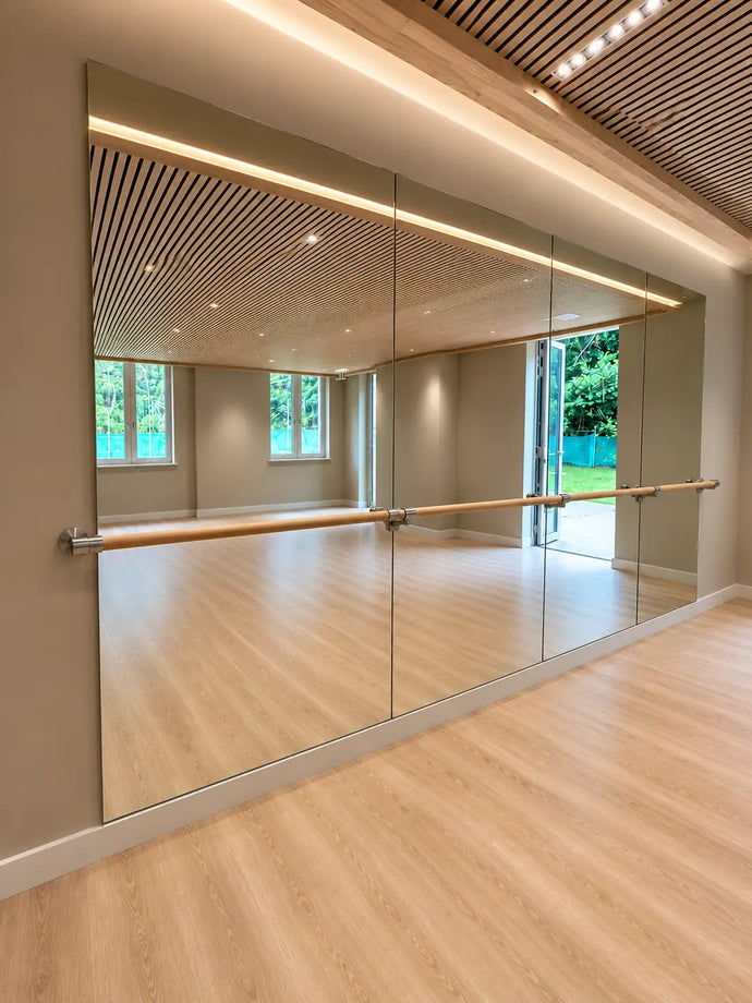 Commercial gym mirror wall installed for Keady Construction