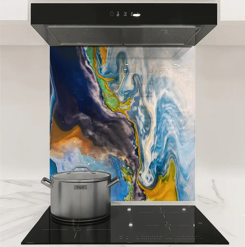 Modern kitchen stovetop with stainless steel pot and colorful abstract backsplash art panel
