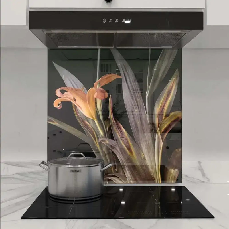 Bespoke floral glass splashback in modern kitchen with induction hob and extractor hood