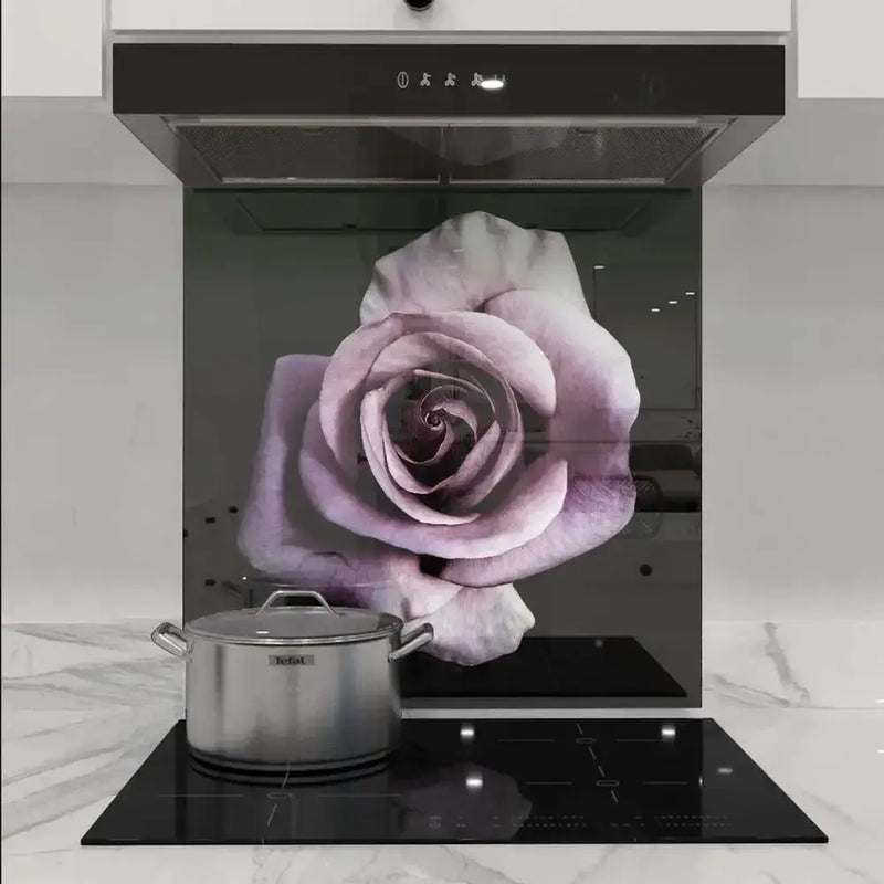 Purple rose printed glass splashback in modern kitchen with induction hob