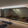 Finished LED halo mirror wall at Studio Glide Pilates in Oxted