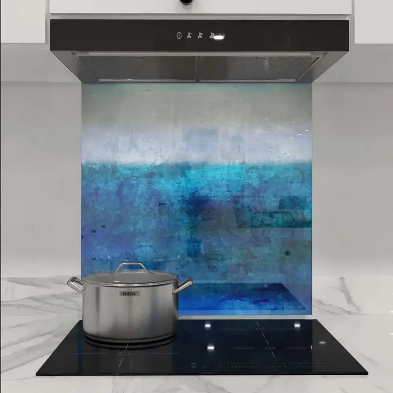 Bespoke blue abstract glass kitchen splashback with modern cooktop and hood